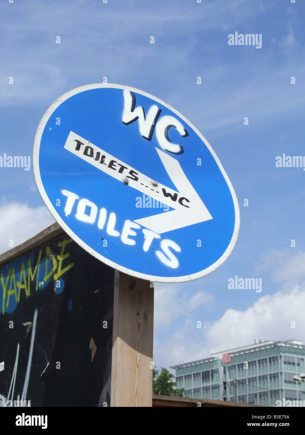 toilet sign by the east side gallery in berlin germany Stock Photo Alamy