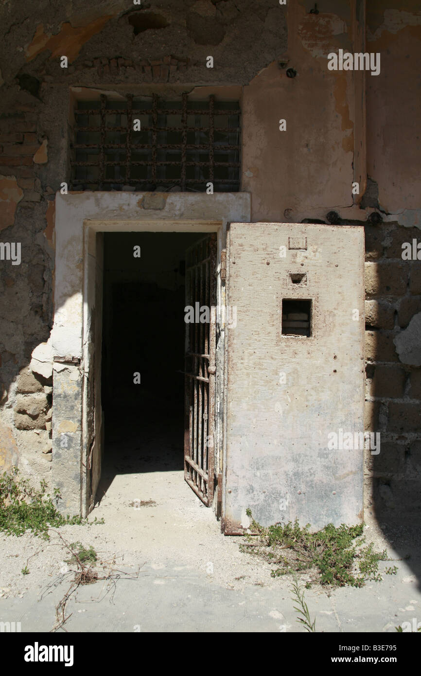 Old Rusty Steel Prison Cell Door In Derelict Jail Stock Photo