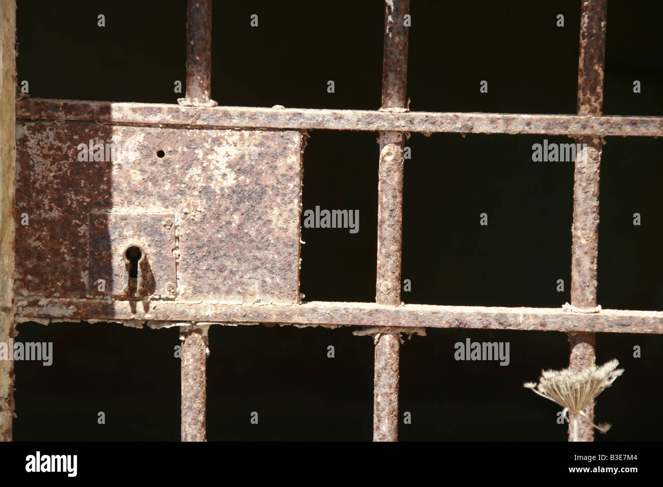 old rusty steel prison cell door in derelict jail Stock Photo