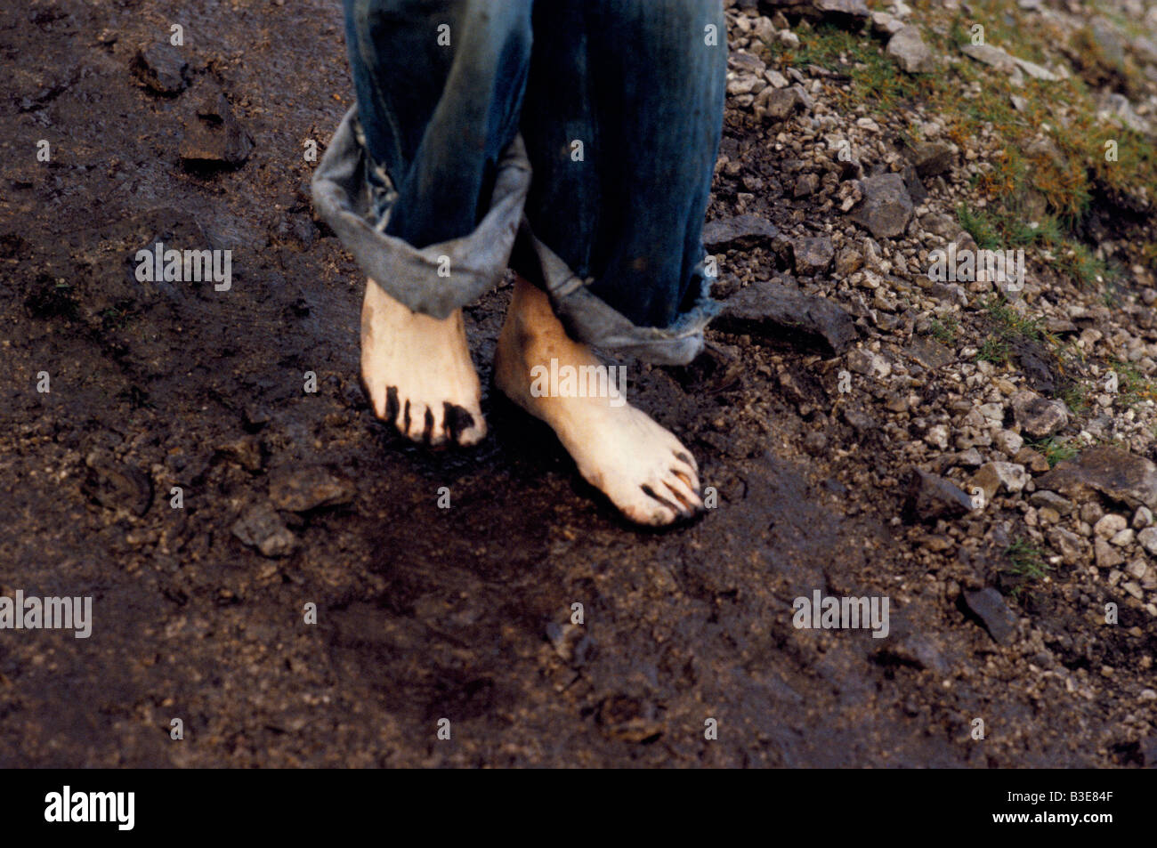 BARE FOOT PILGRIM WALKING ON STONEY PATH IN CROAGH PATRICK EIRE 1979