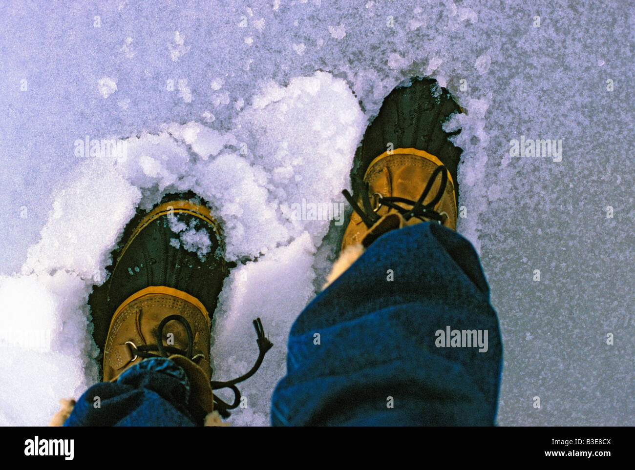 Weatherproof warm boots tackle a messy winter storm Stock Photo