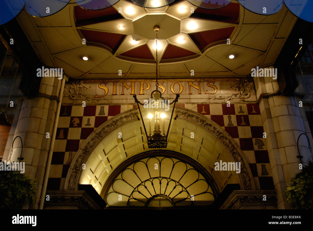 Simpson's restaurant entrance at night The Strand London England Stock Photo