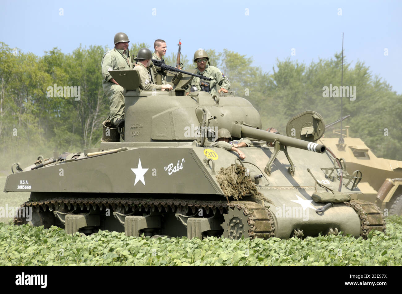 American soldiers aboard an American tank during a WWII reenactment in Bellville, Michigan Stock Photo