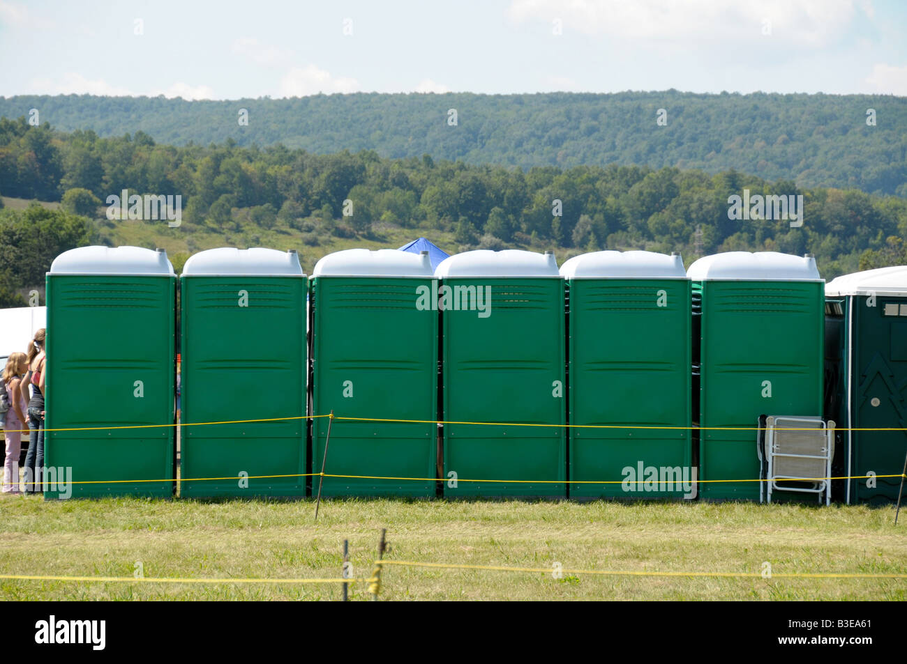 A row of portable toilets at festival. Stock Photo