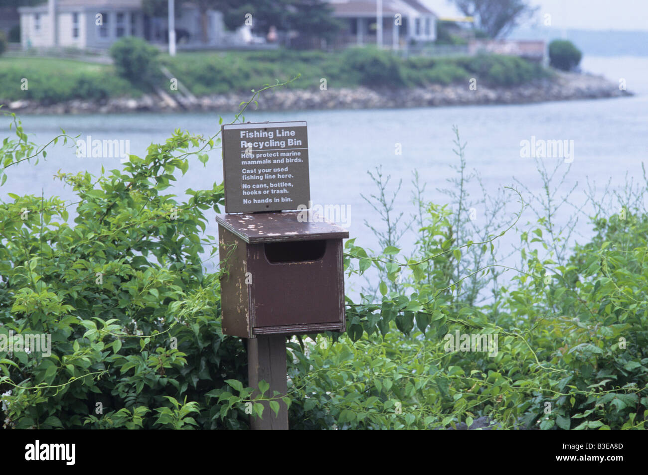 fishing line recycle bin sign on water on Cape Cod Stock Photo Alamy