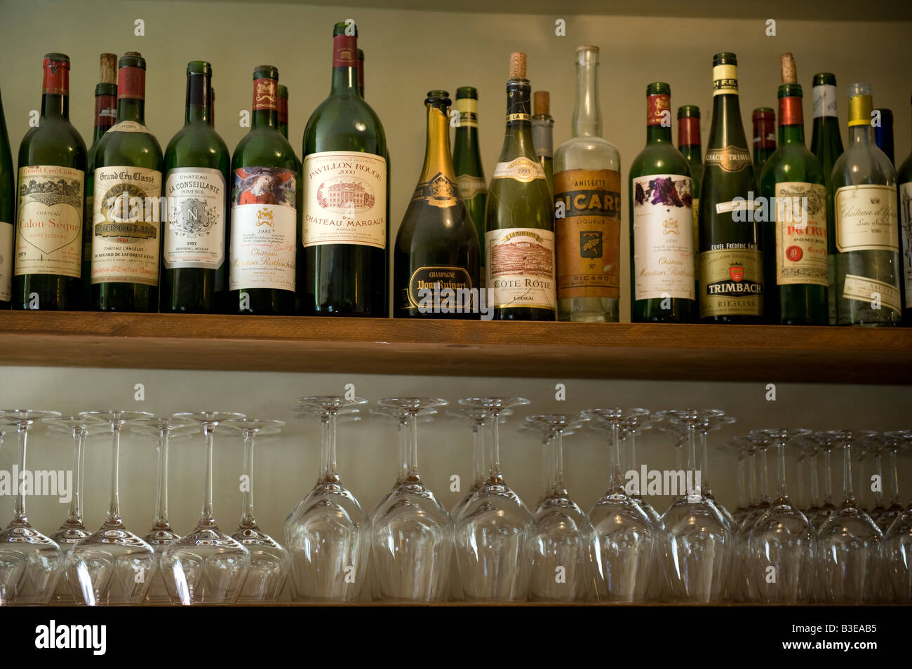 Wine Bottles & Glasses on Shelf Stock Photo Alamy