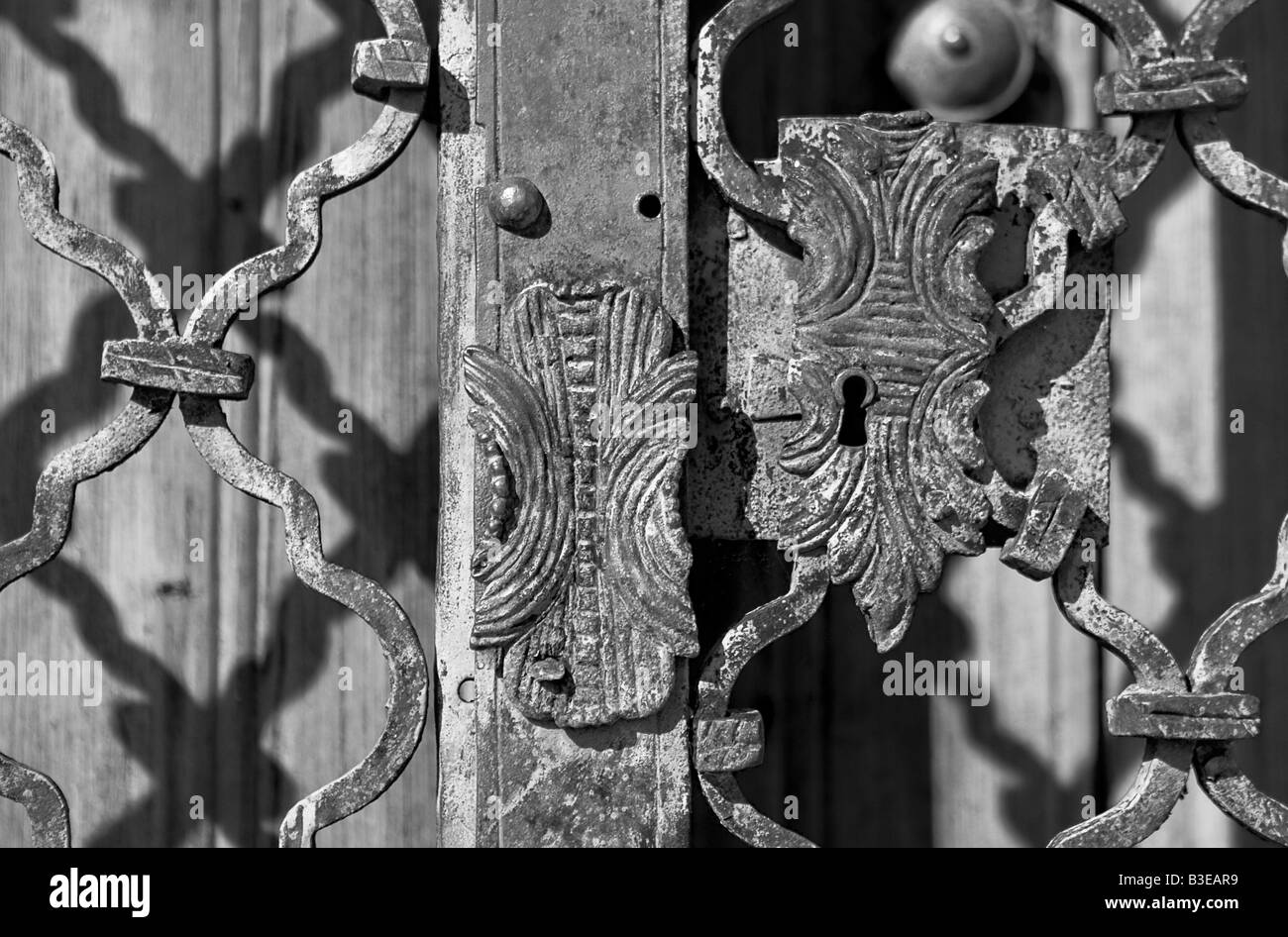 Rusty old lock on an iron door the photo is black and white Stock Photo ...