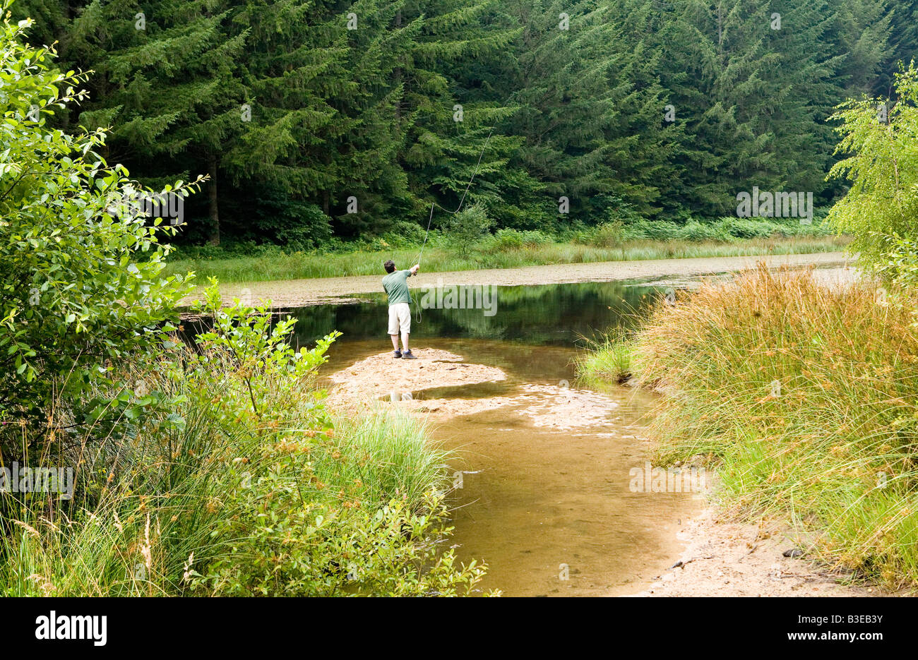 Man Fly Fishing In Quiet Stock Photos &amp; Man Fly Fishing In ...