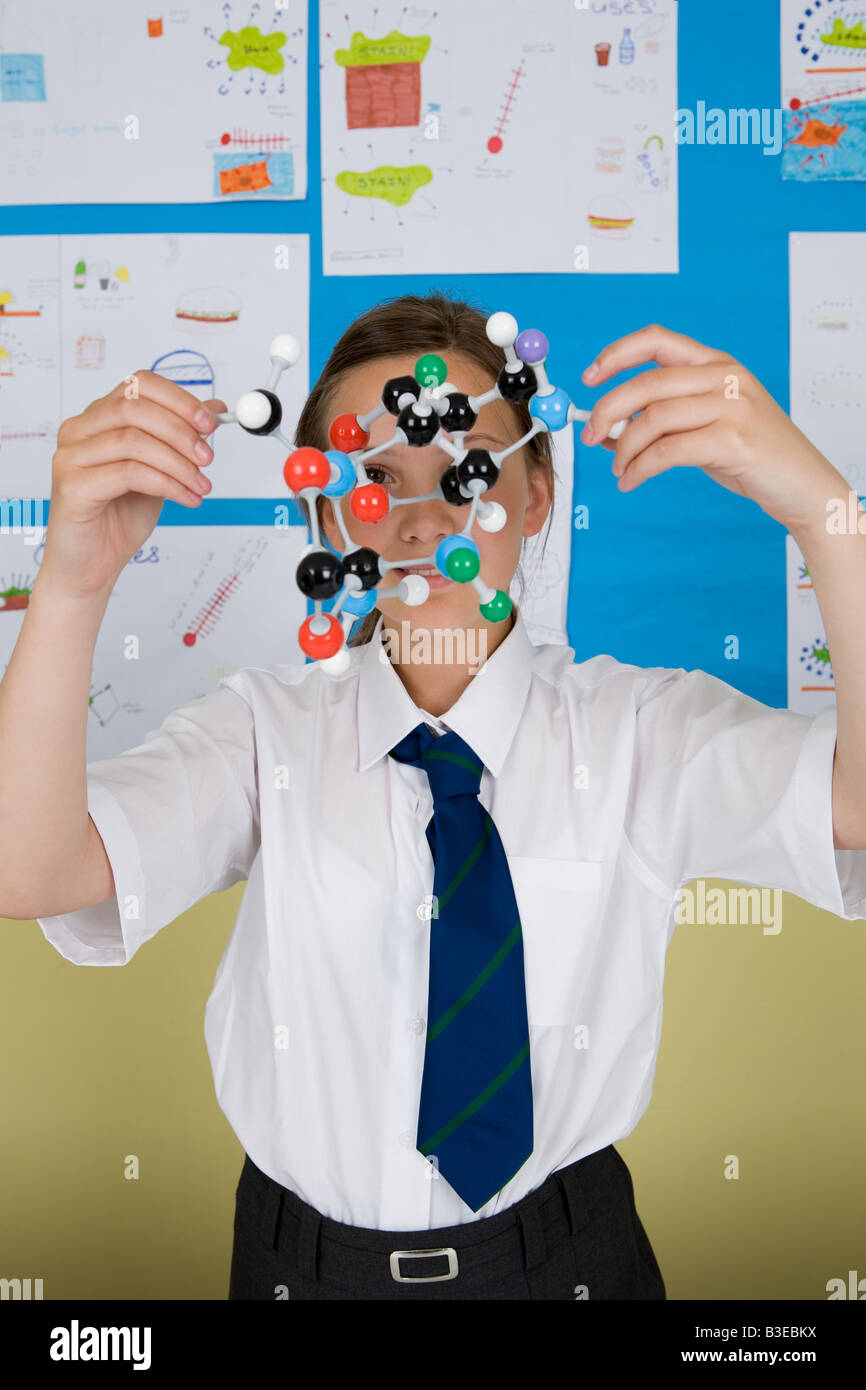 Girl with molecule model Stock Photo