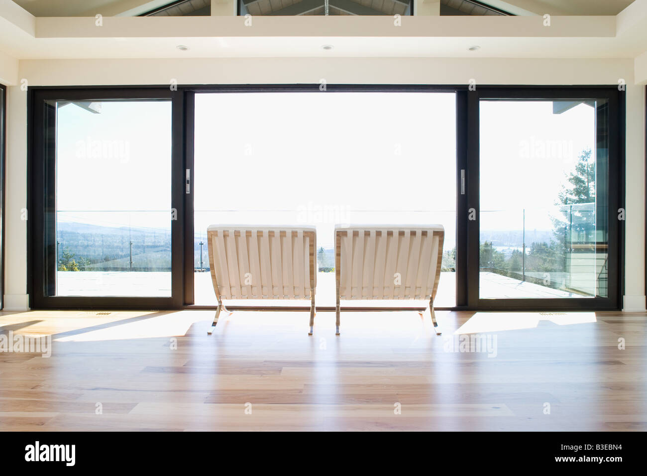 Chairs by patio doors Stock Photo Alamy