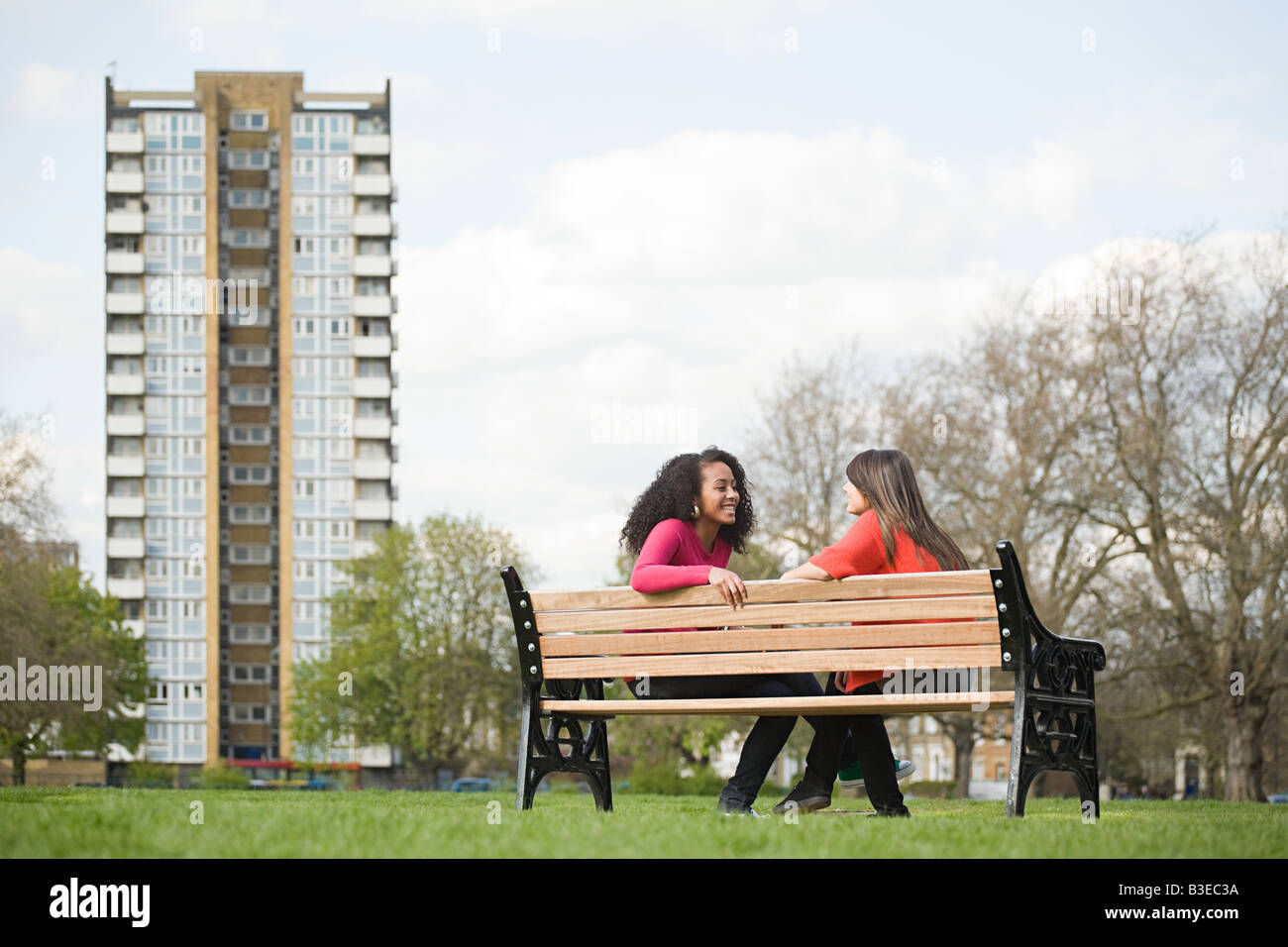 Two teenage girls on a bench Stock Photo