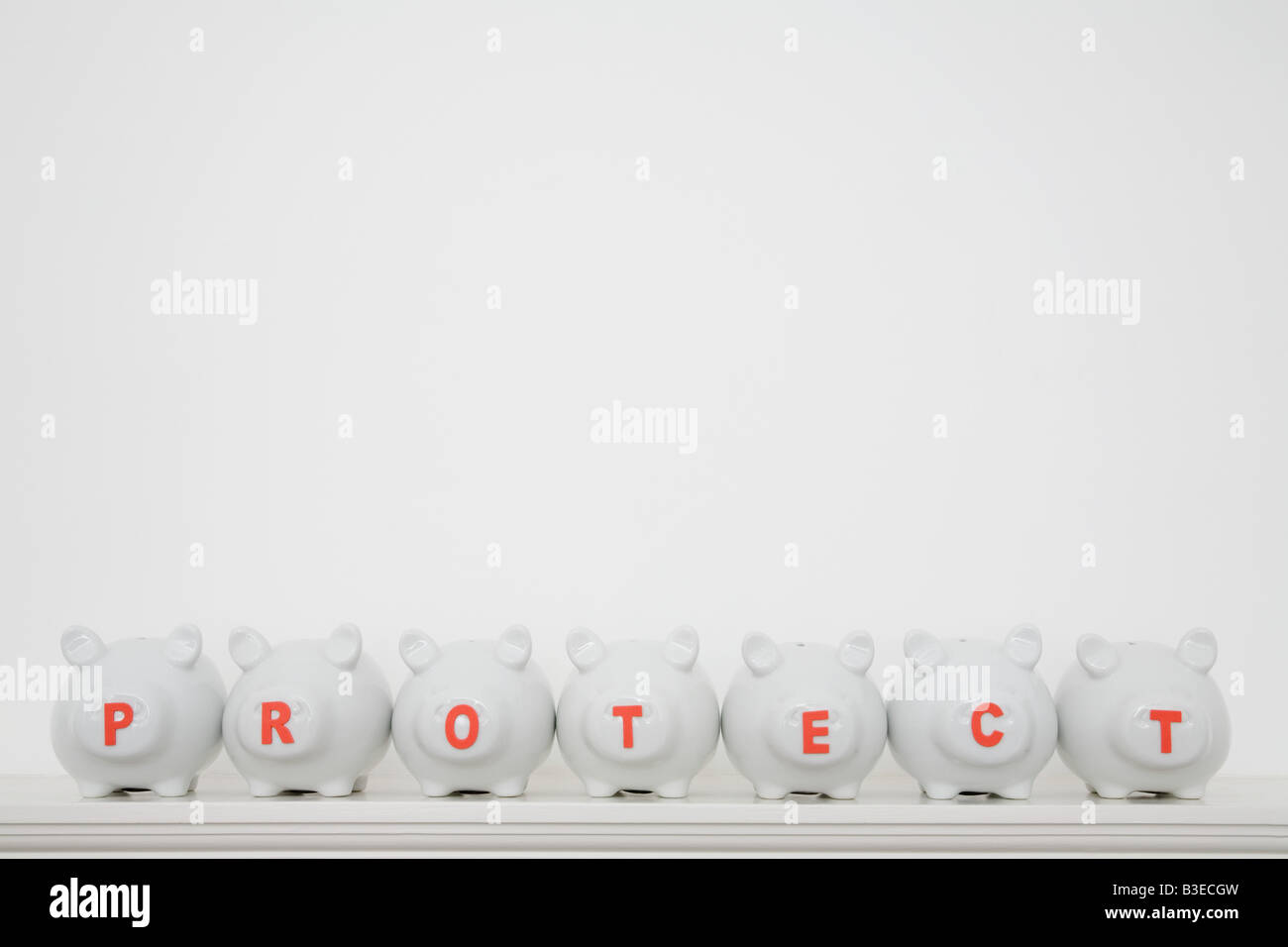 Piggy banks in a row Stock Photo - Alamy