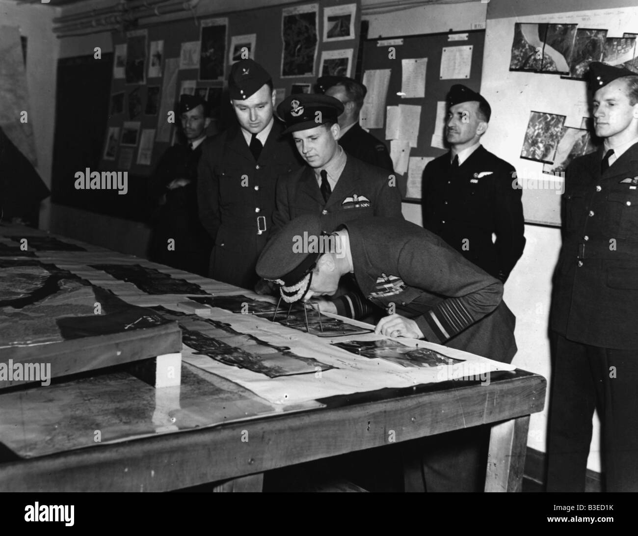 George VI inspects aerial photos / 1944 Stock Photo