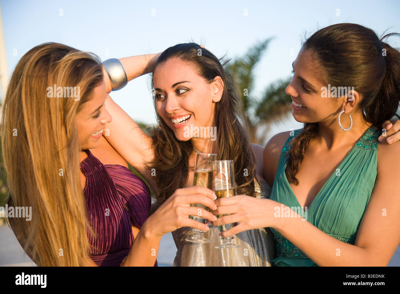 Three women drinking champagne Stock Photo - Alamy
