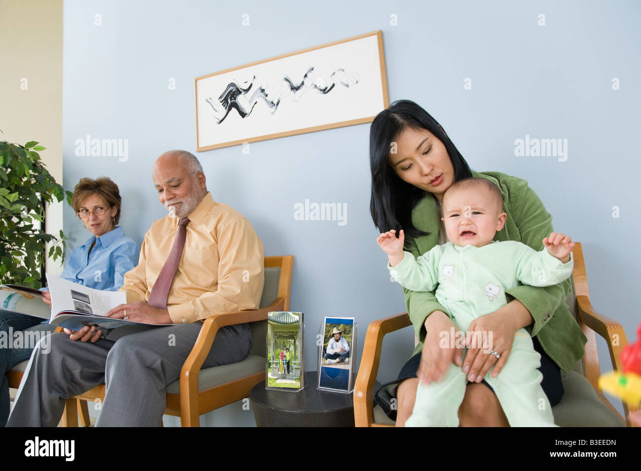 Patients waiting in a doctors office Stock Photo Alamy