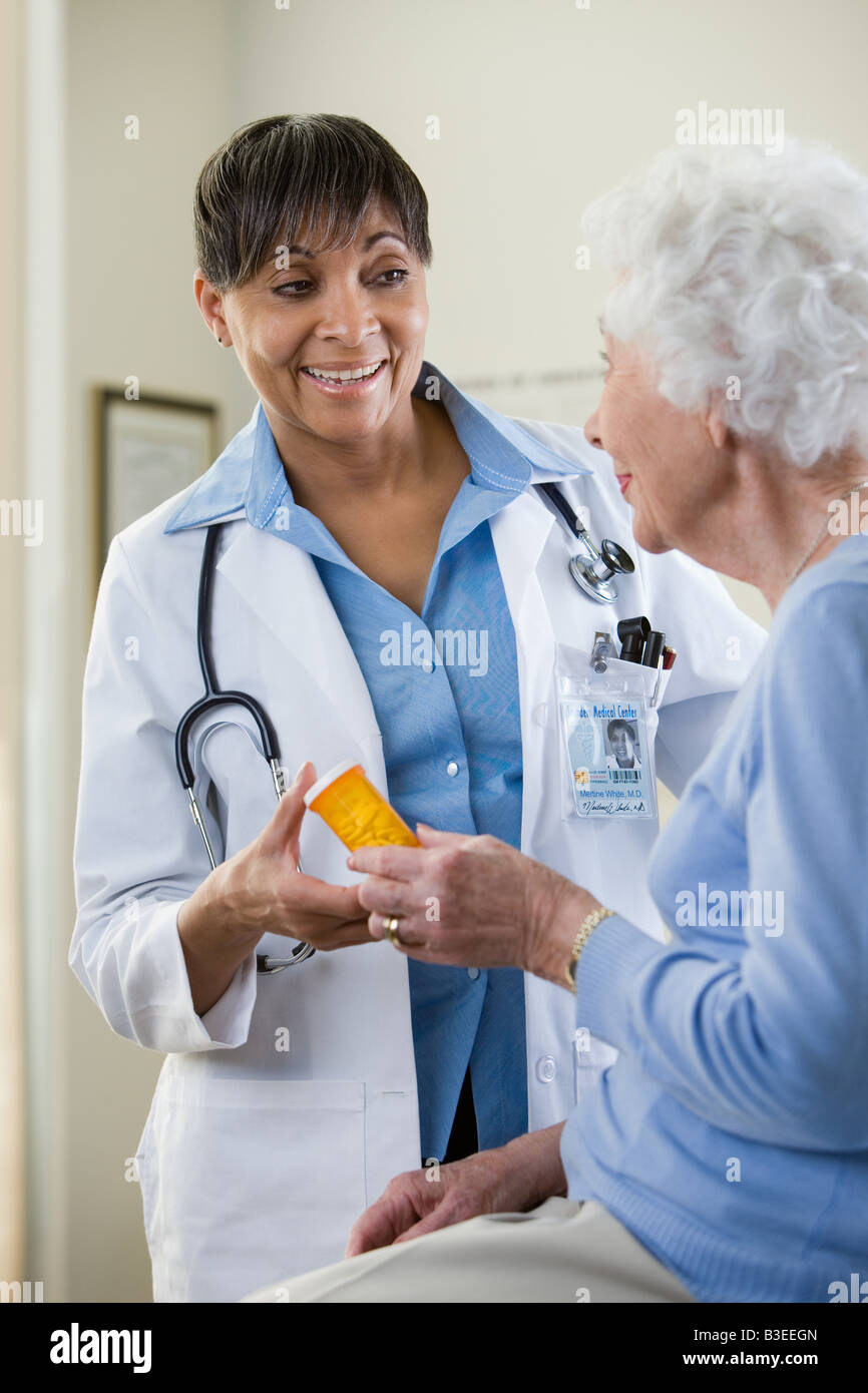 A doctor handing a patient tablets Stock Photo
