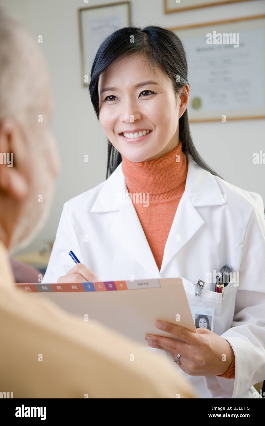 Doctor older patient interaction hi-res stock photography and images ...
