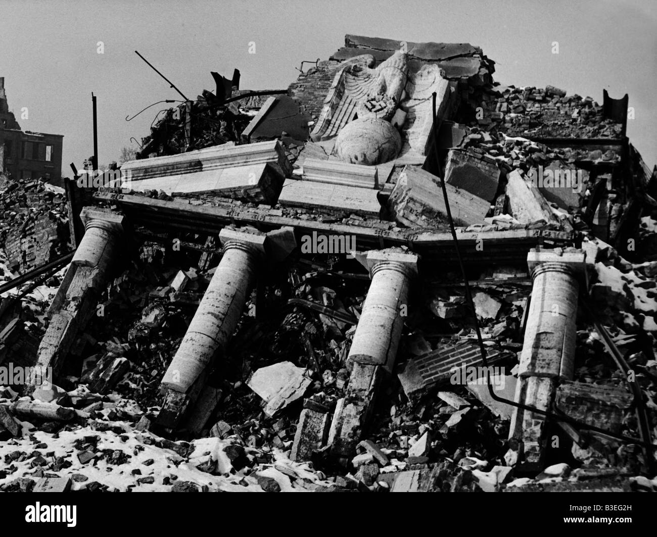 Collapsed building with Nazi symbol/1945 Stock Photo
