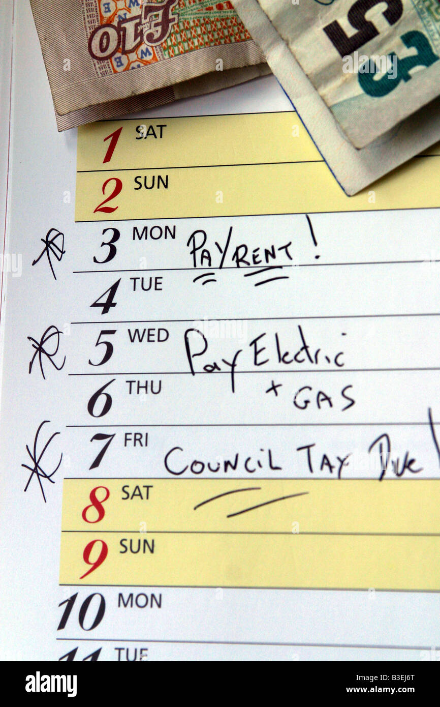 calendar marked with pay rent , council tax, gas and electric bills due Stock Photo