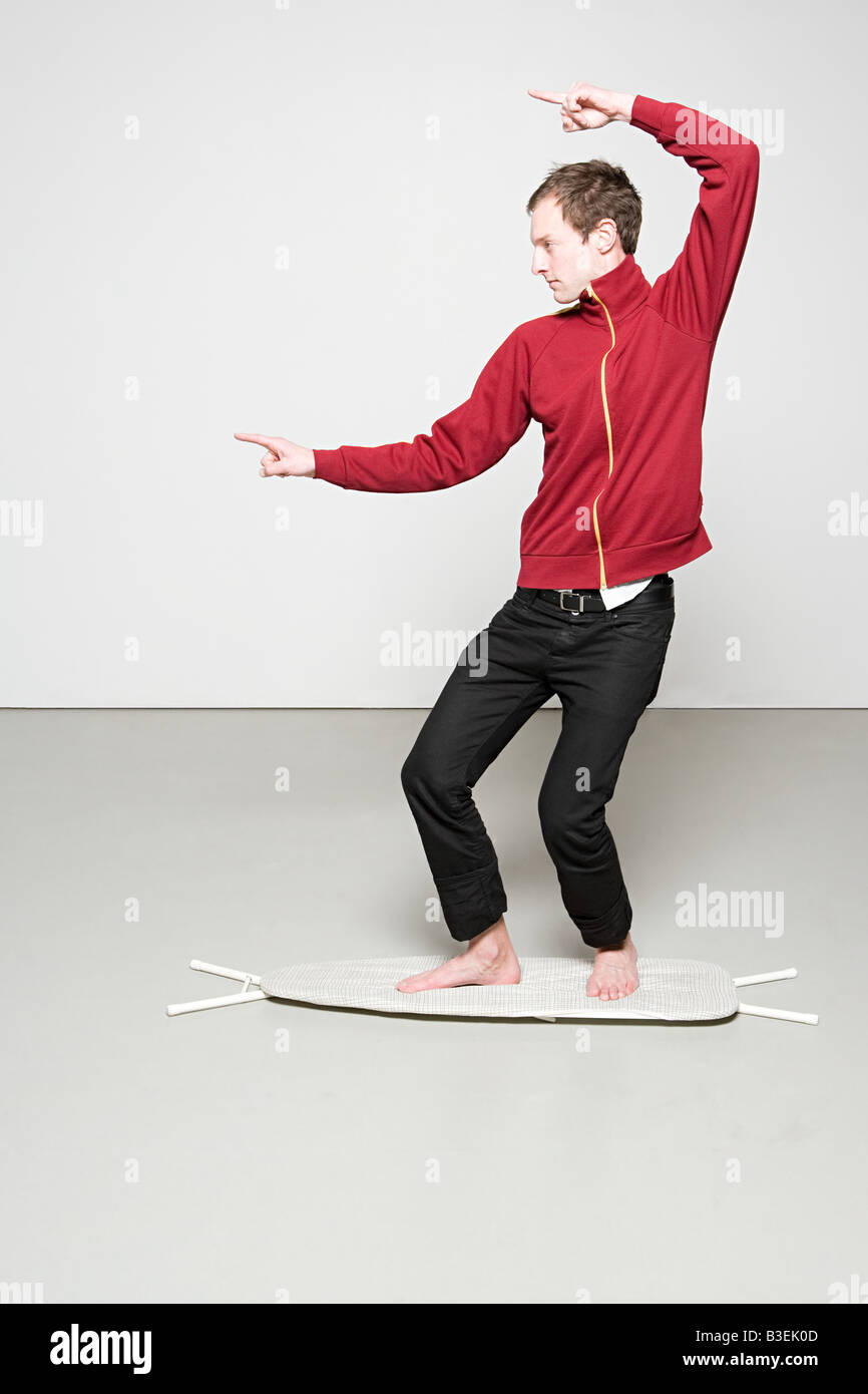 Man surfing on an ironing board Stock Photo
