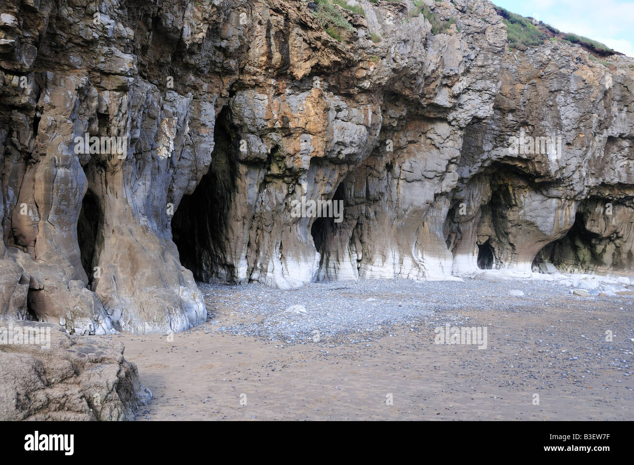 Rock formations on Pendine beach Carmarhenshire Wales Stock Photo