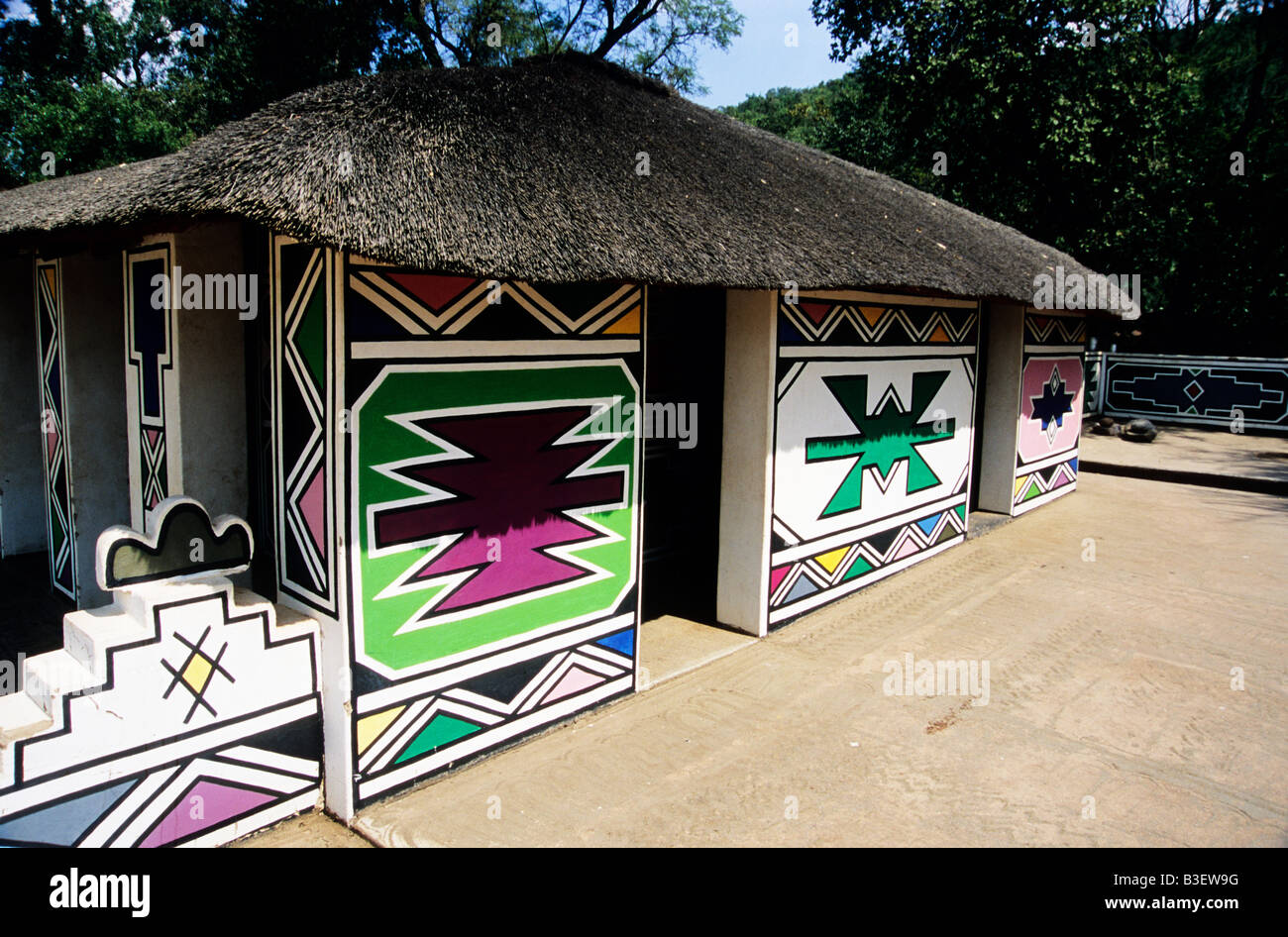 House, housing, colourful geometric shapes, patterns, traditional Ndebele hut, ethnic, culture, travel, building, South Africa, theme village Stock Photo