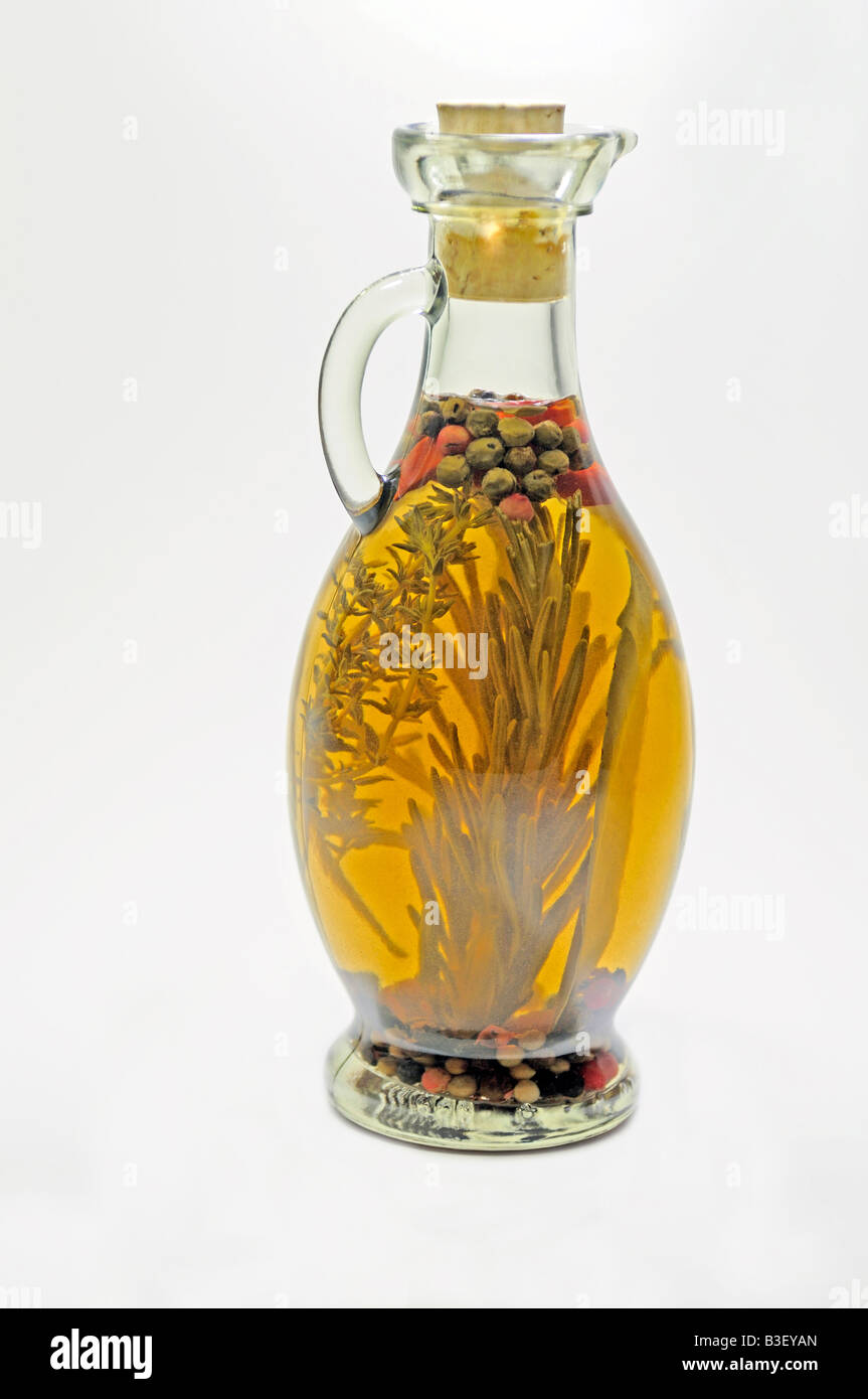 Vinegar infused with spices and herbs. studio picture Stock Photo