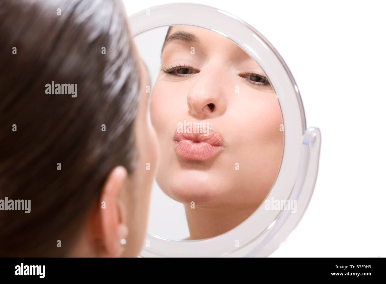 Young woman pursing lips, portrait Stock Photo Alamy