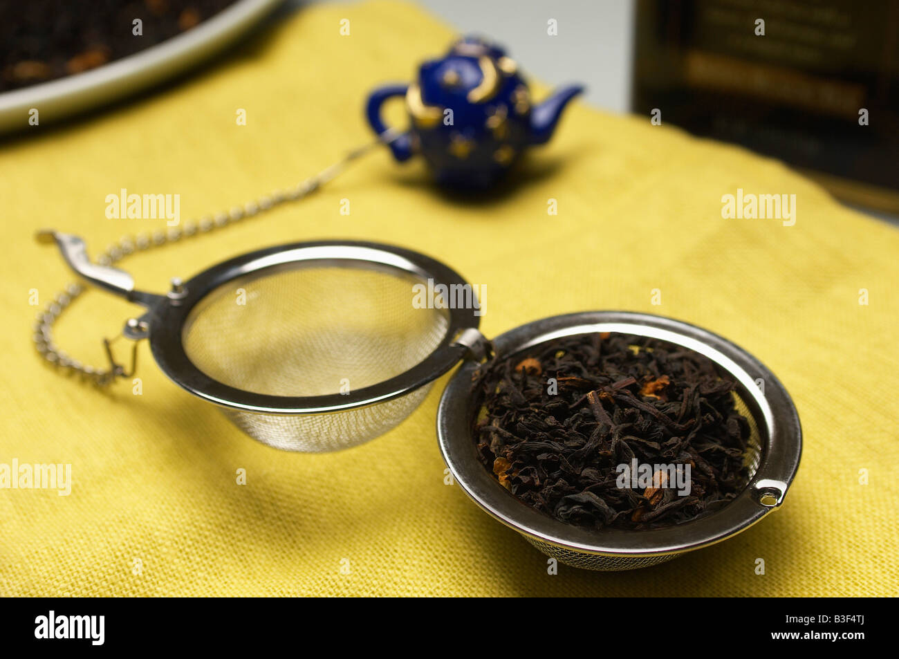 Tea strainer with leaves Stock Photo Alamy