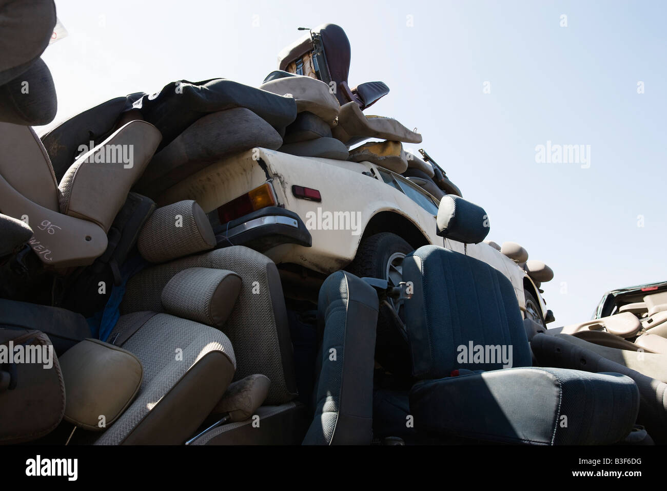 Heap of car seats in junkyard Stock Photo Alamy