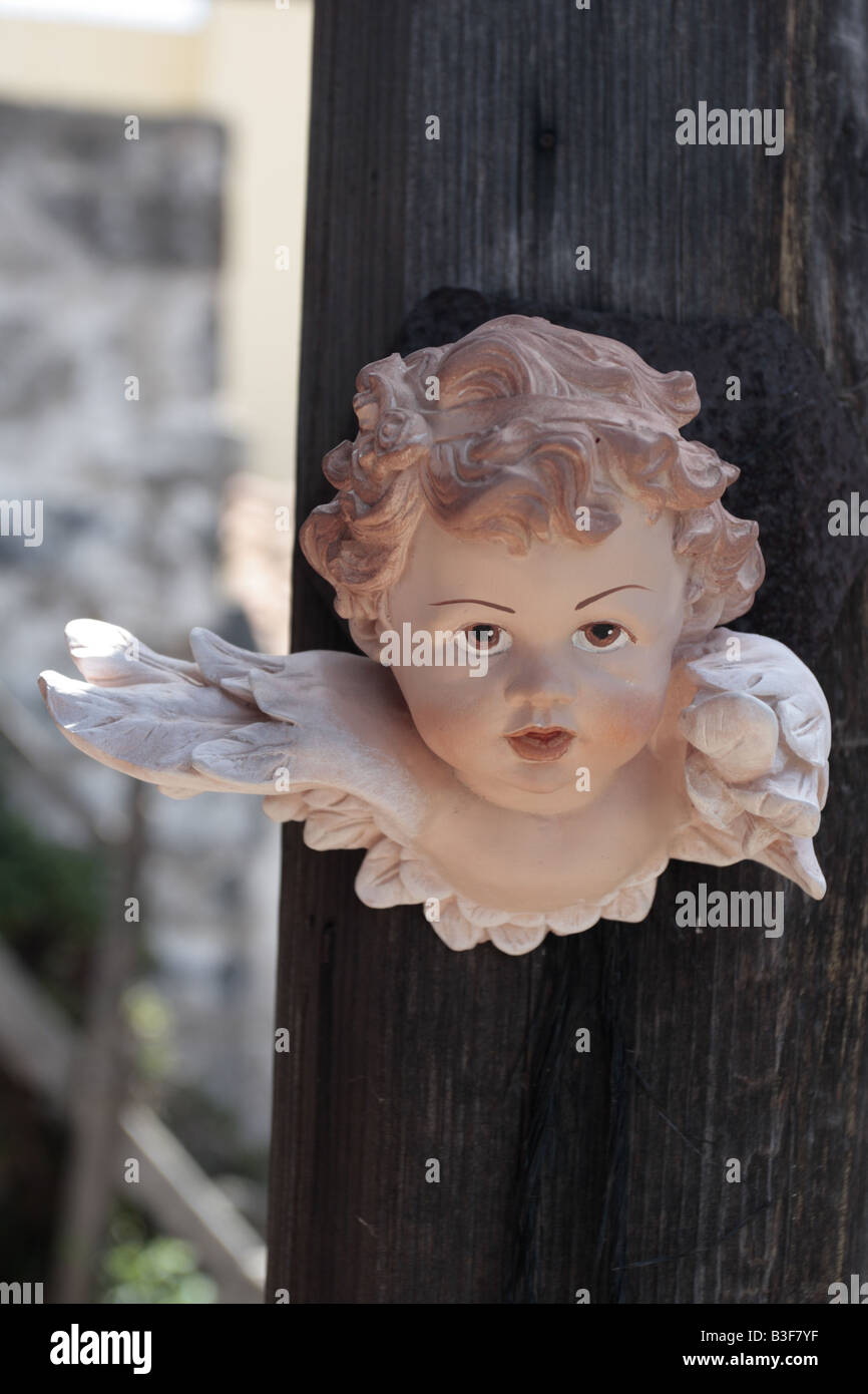 Plaster angel head hanging on a post Chirche Tenerife Canary Islands Spain Stock Photo