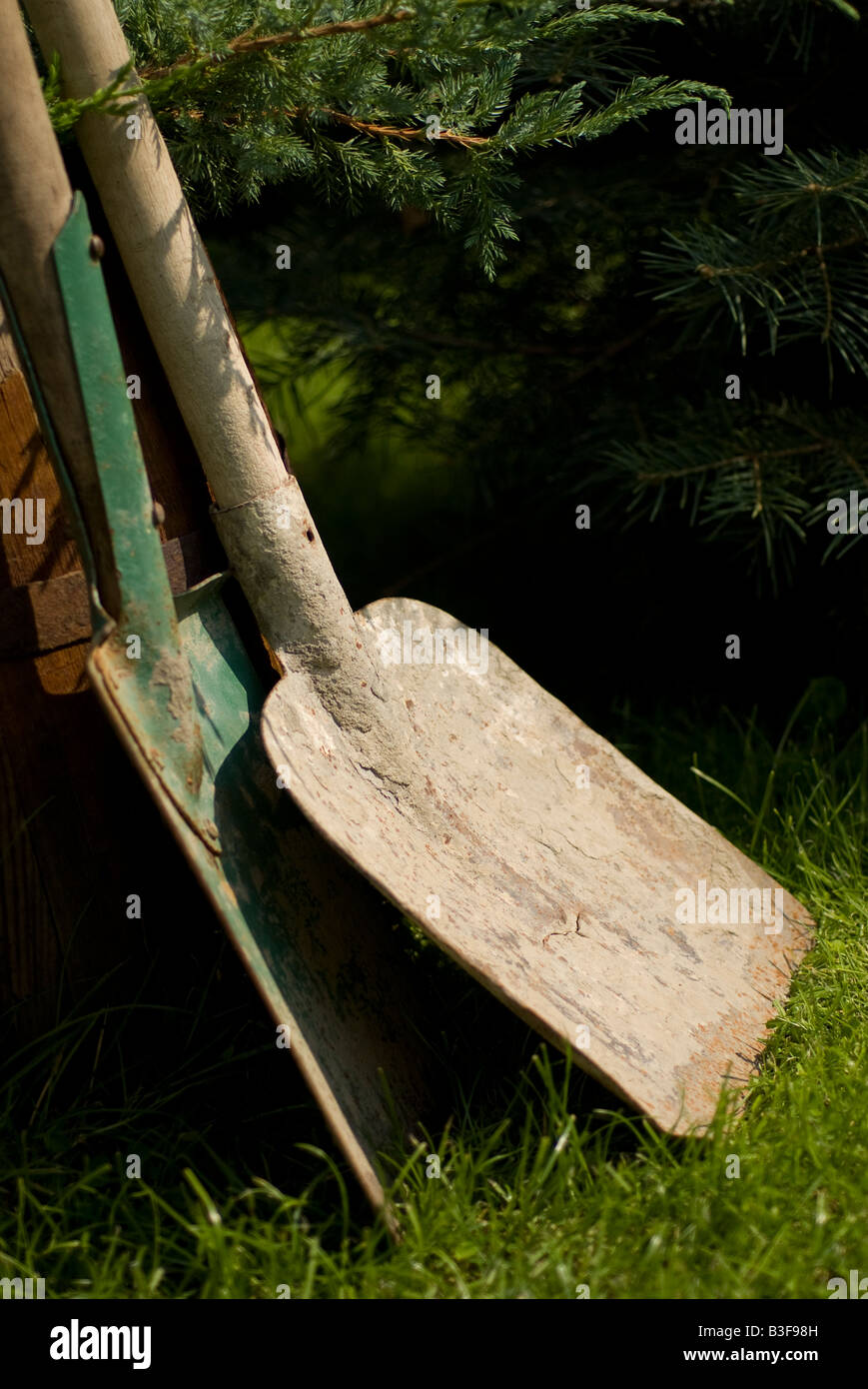 spades leaned on barrel Stock Photo Alamy