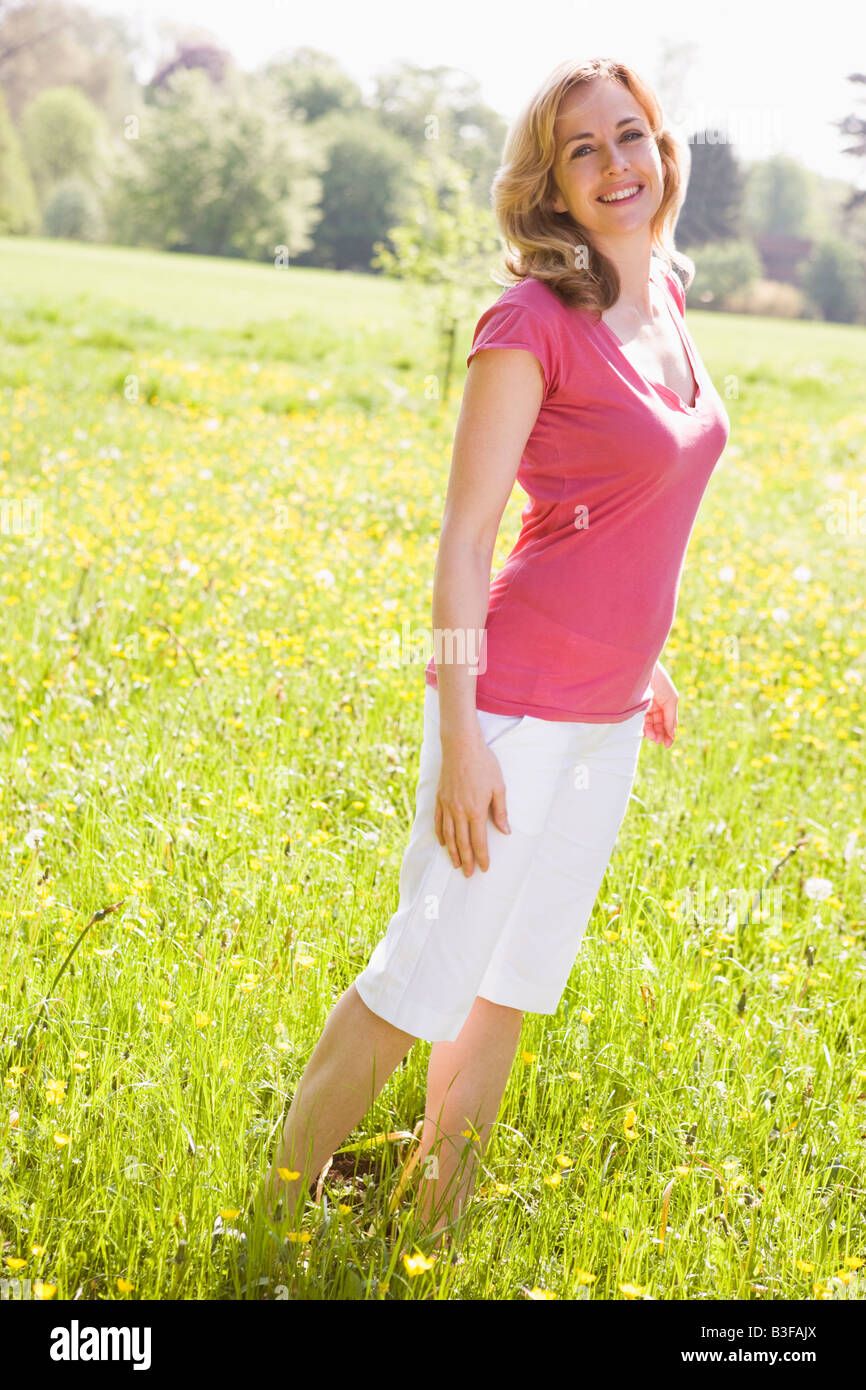 Woman standing outdoors hi-res stock photography and images - Alamy