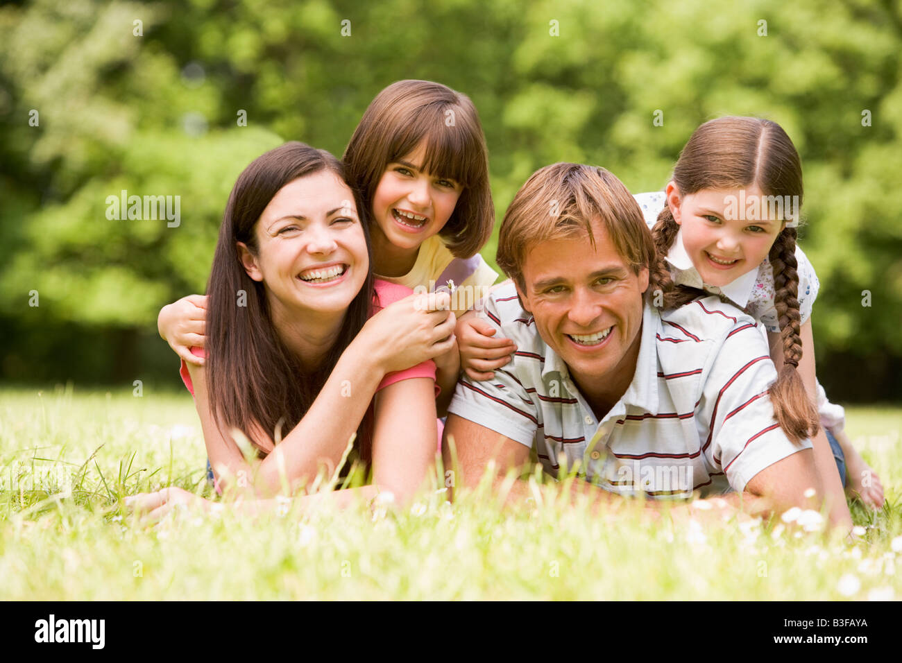 Family outdoors smiling Stock Photo - Alamy