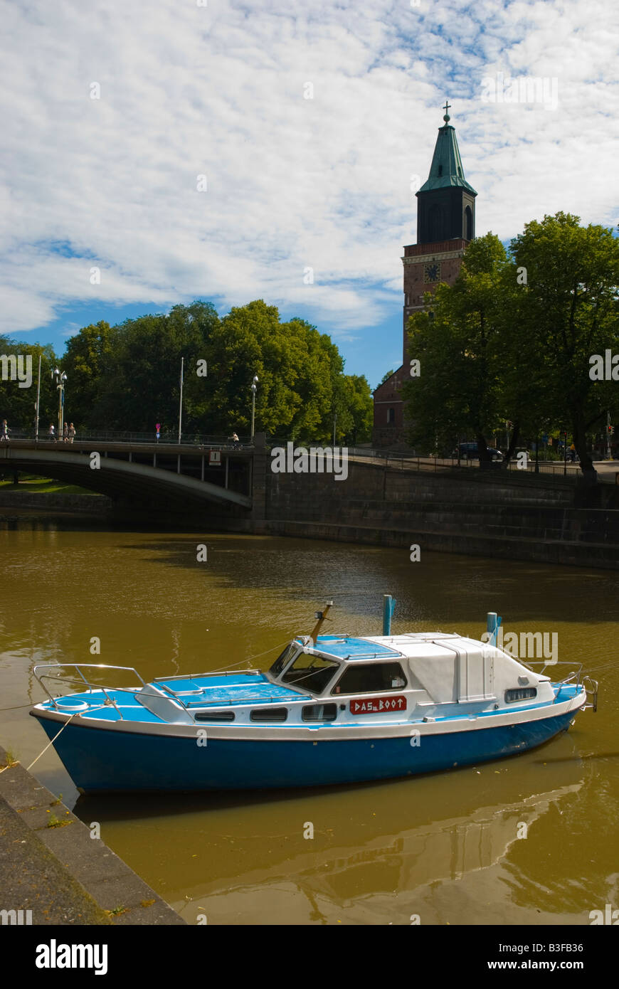 Boat in Aurajoki river with the Cathedral in the background in Turku Finland Europe Stock Photo