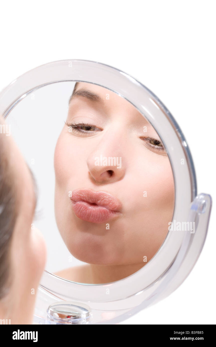 Young woman pursing her lips, portrait Stock Photo Alamy