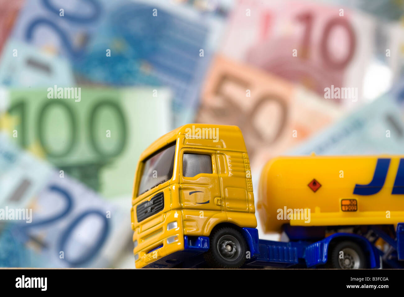 Lorry in front of banknotes Stock Photo