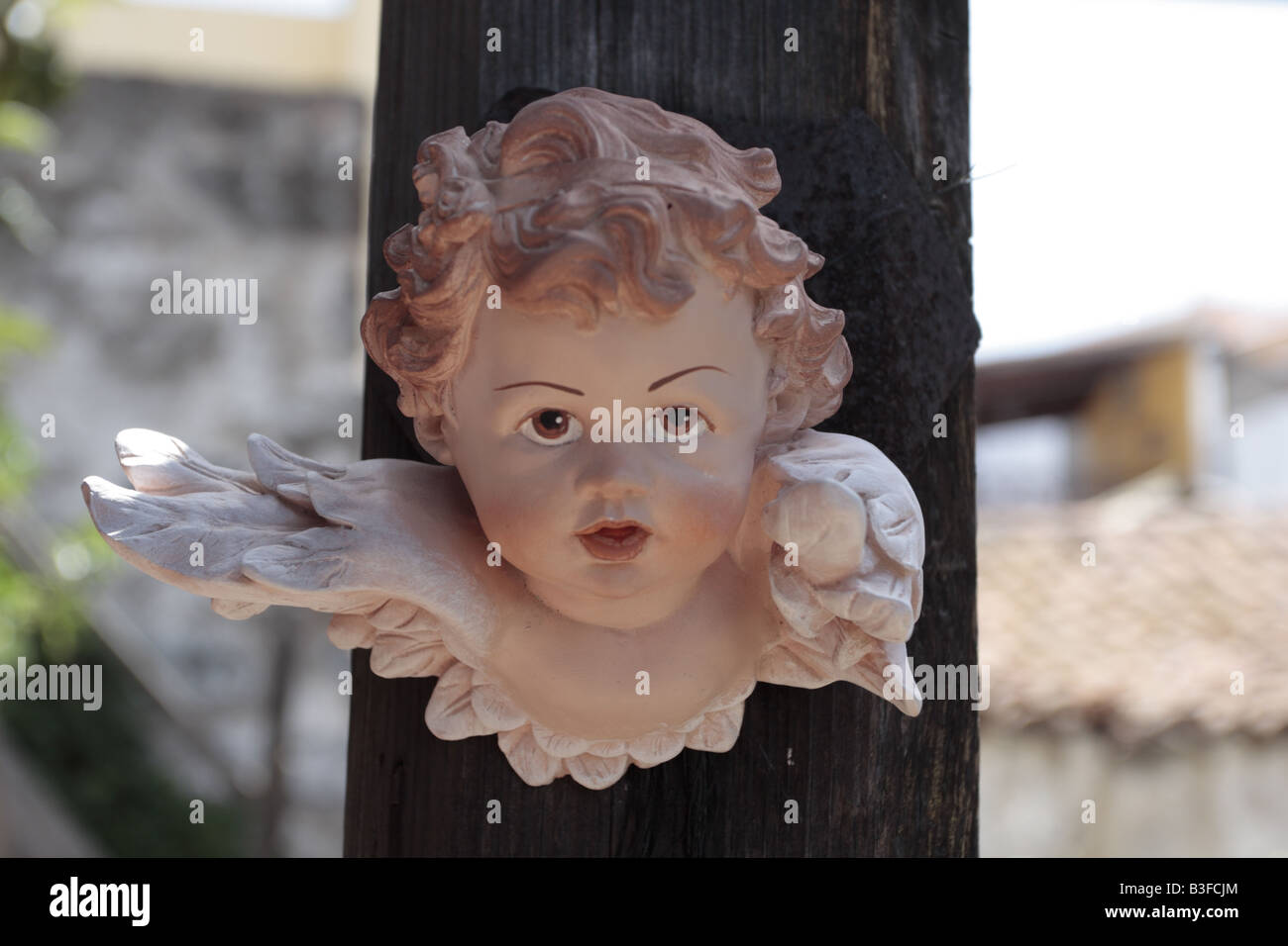 Plaster angel head hanging on a post Chirche Tenerife Canary Islands Spain Stock Photo