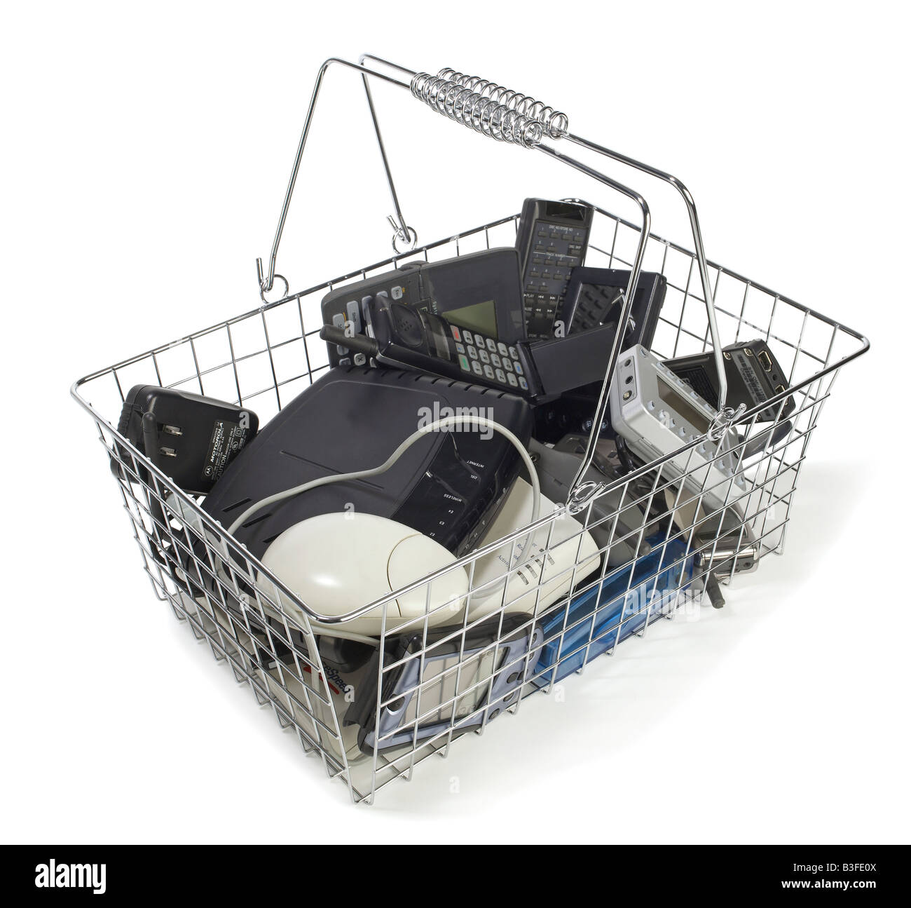 Shopping basket with old tech gadgets Stock Photo