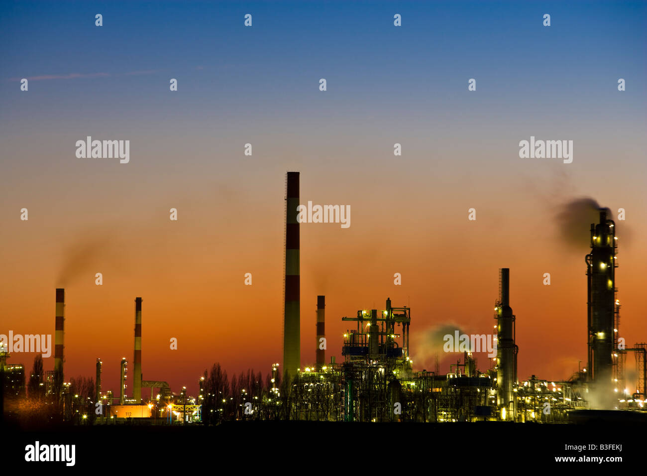 Oil refinery at dusk Stock Photo - Alamy