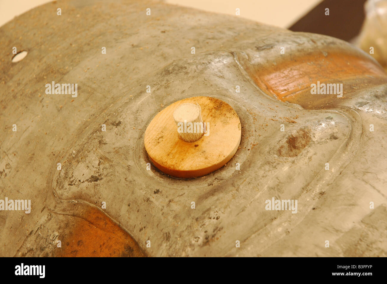 Close up of a wooden peg in a metal cask of real ale. Landscape. Stock Photo