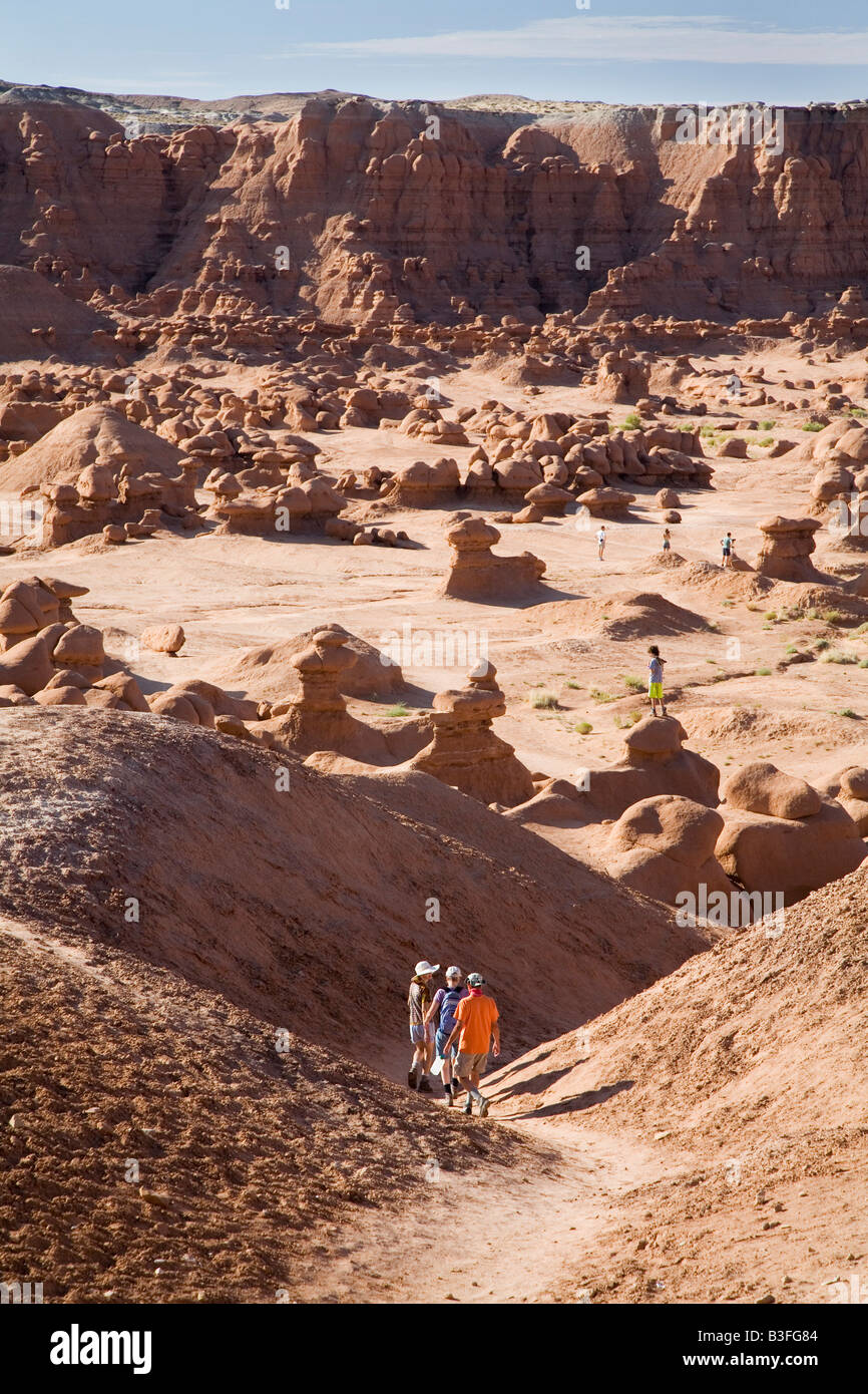 Green River Utah Hikers in Goblin Valley State Park where sandstone has eroded into unusual mushroom shapes Stock Photo