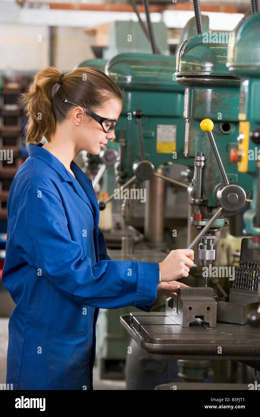 Machinist working on machine Stock Photo Alamy
