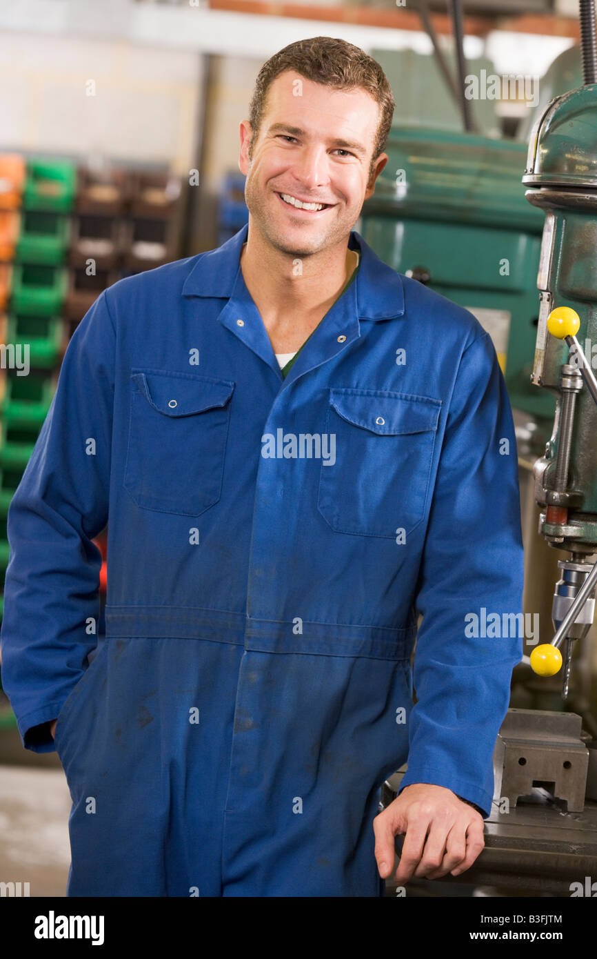 Machinist working on machine Stock Photo Alamy