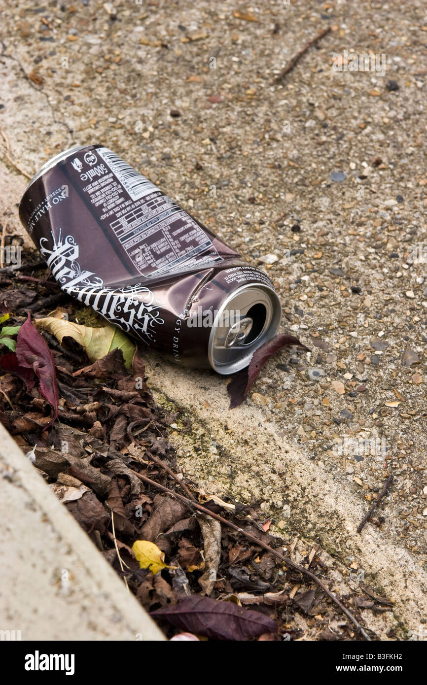 A crushed tin can in the gutter, UK Stock Photo Alamy