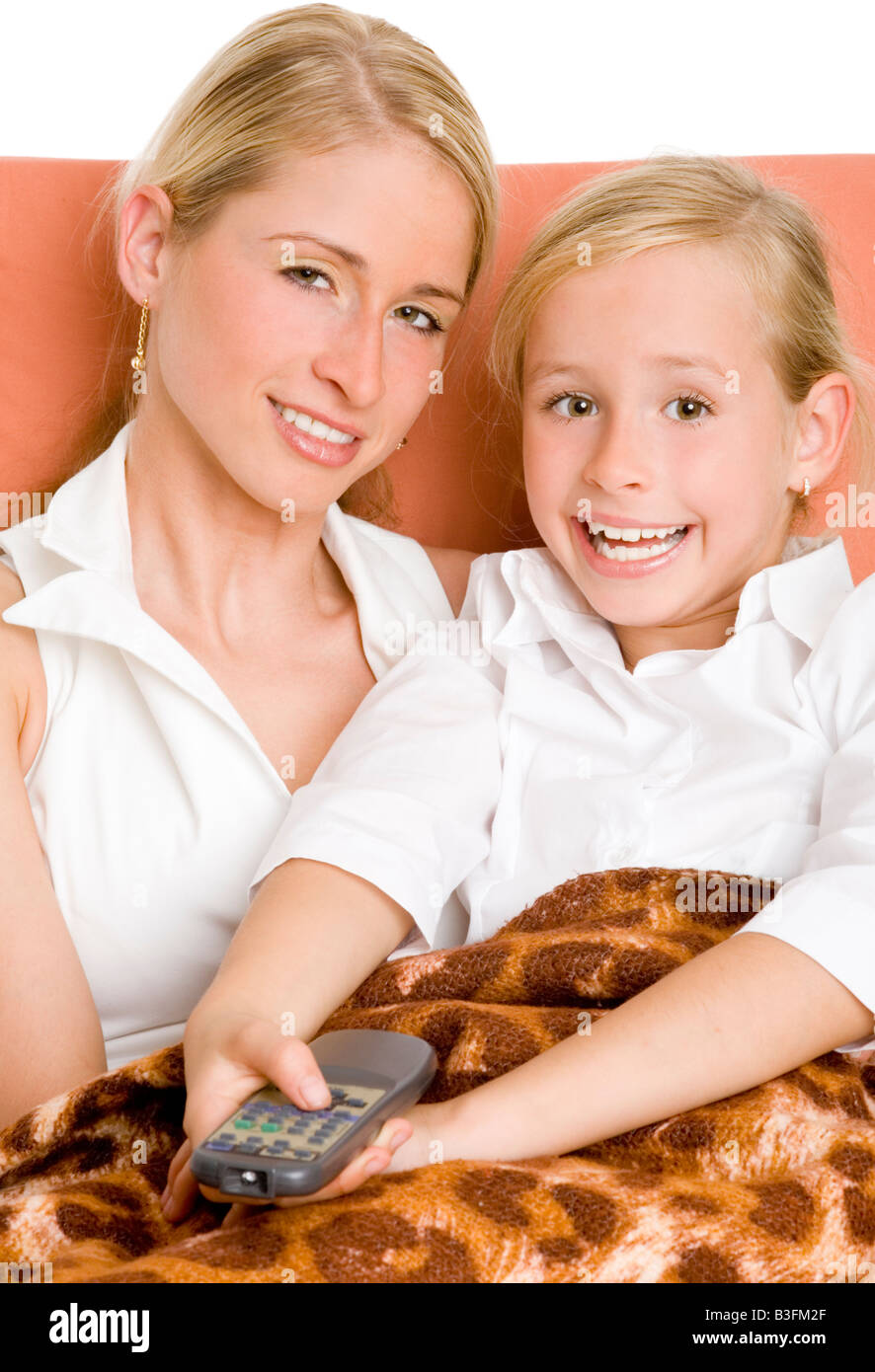 mother and daughter watching tv Stock Photo