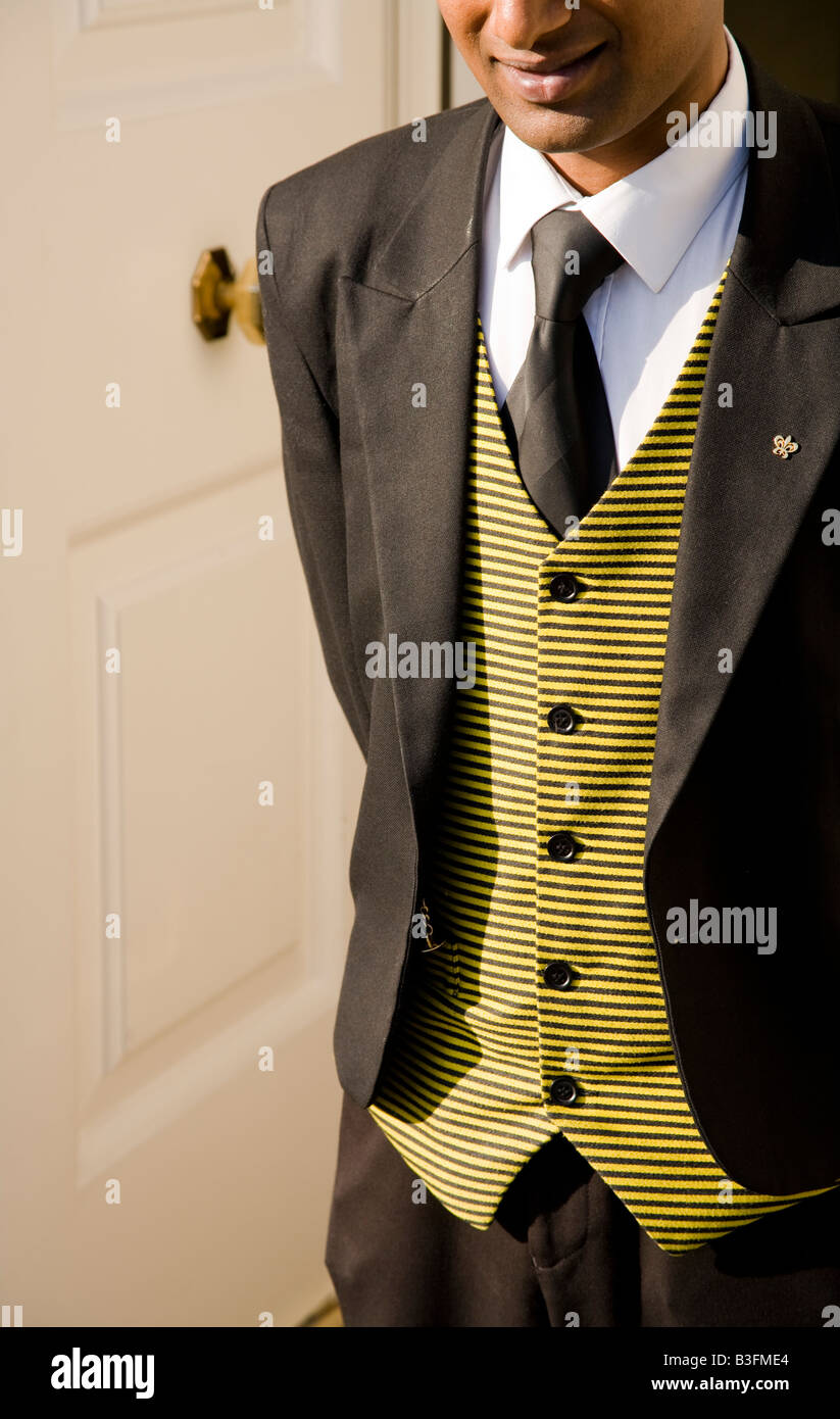 A smartly dressed concierge doorman in his suit Stock Photo Alamy