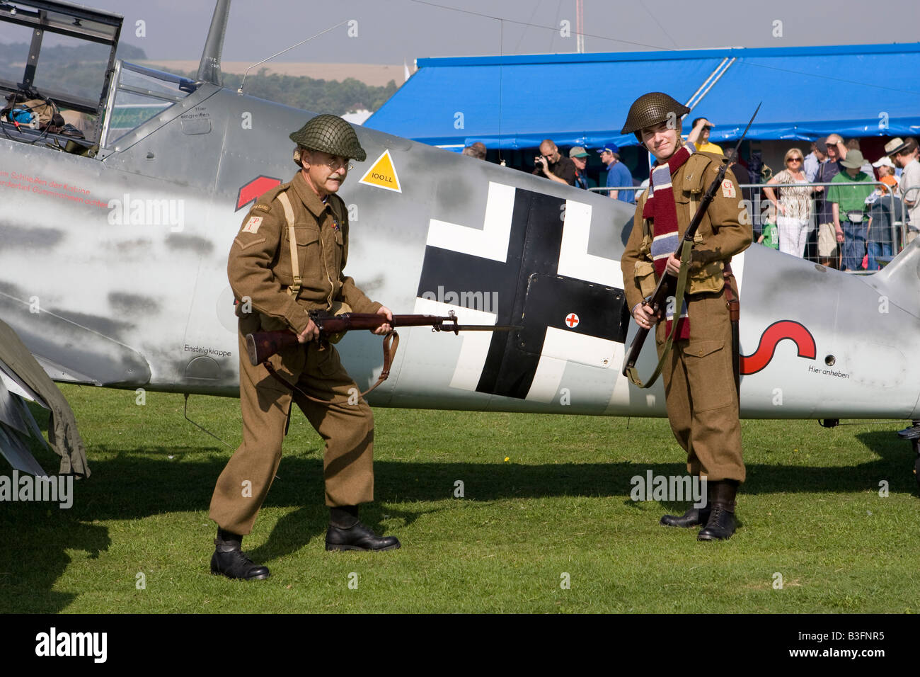 Two Dad s Army lookalike actors pose in front of Messerschmidt at RAFA Charity Airshow Shoreham Airshow Sussex England Stock Photo