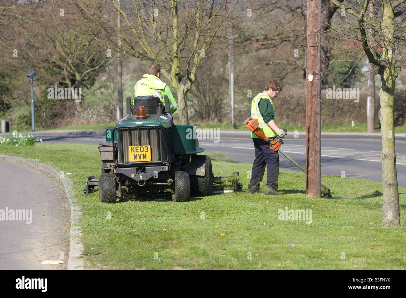 Council workers cutting the grass in Potters Bar Hertfordshire UK Stock Photo
