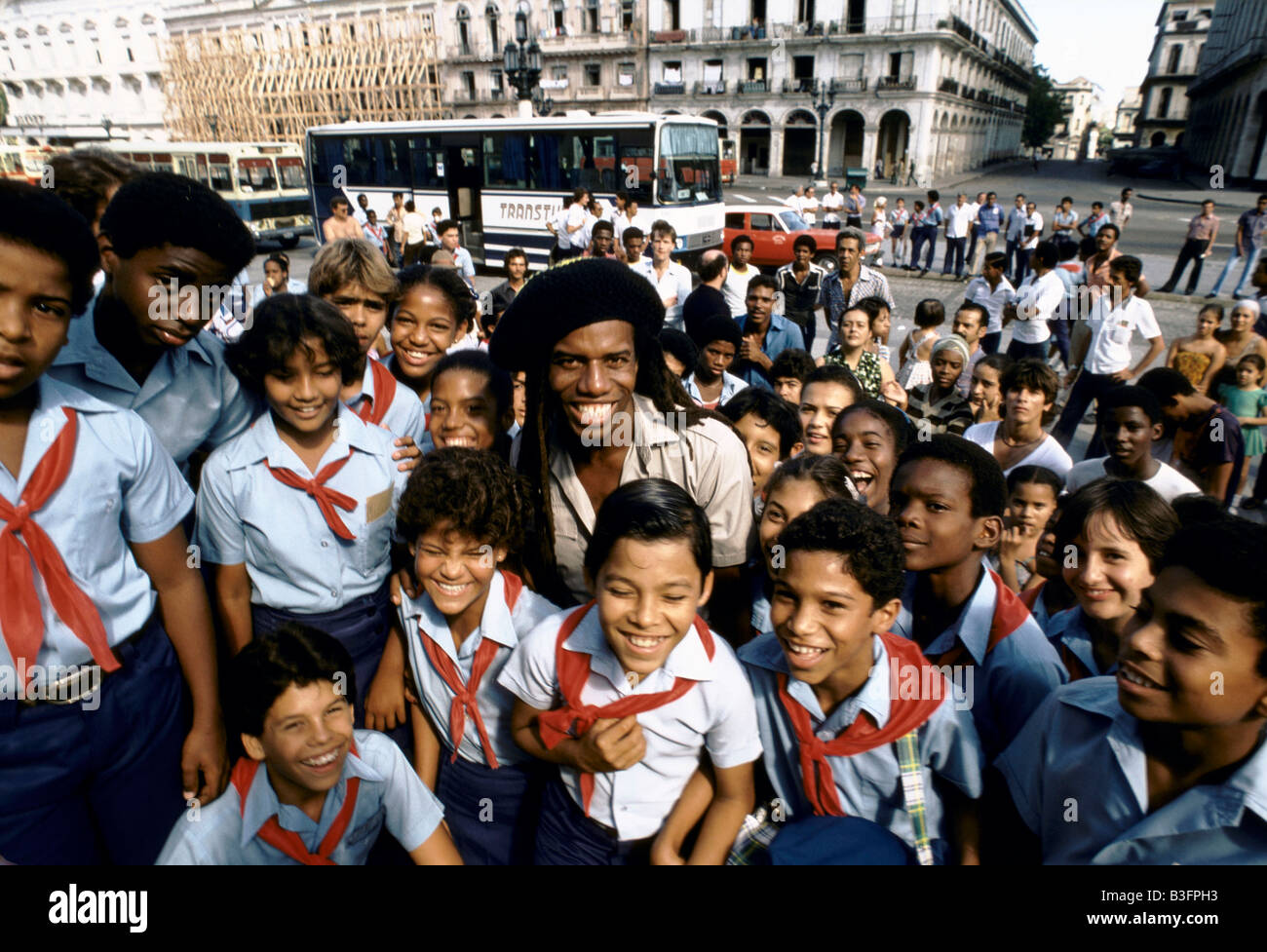 British musician Eddie Grant with school children on street, Havana Cuba Stock Photo